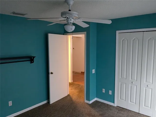 a view of a room with closet and wooden floor
