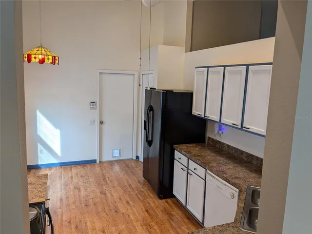 a view of a livingroom with a table and chairs
