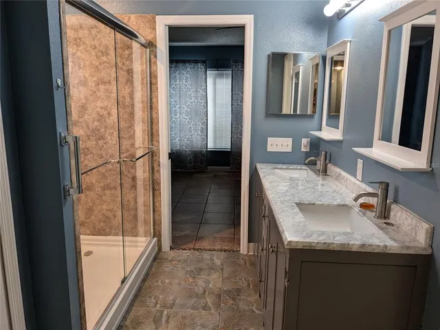 a bathroom with a bathtub and a shower