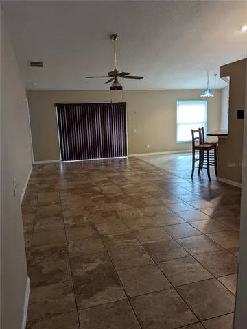 a view of livingroom with furniture and workspace