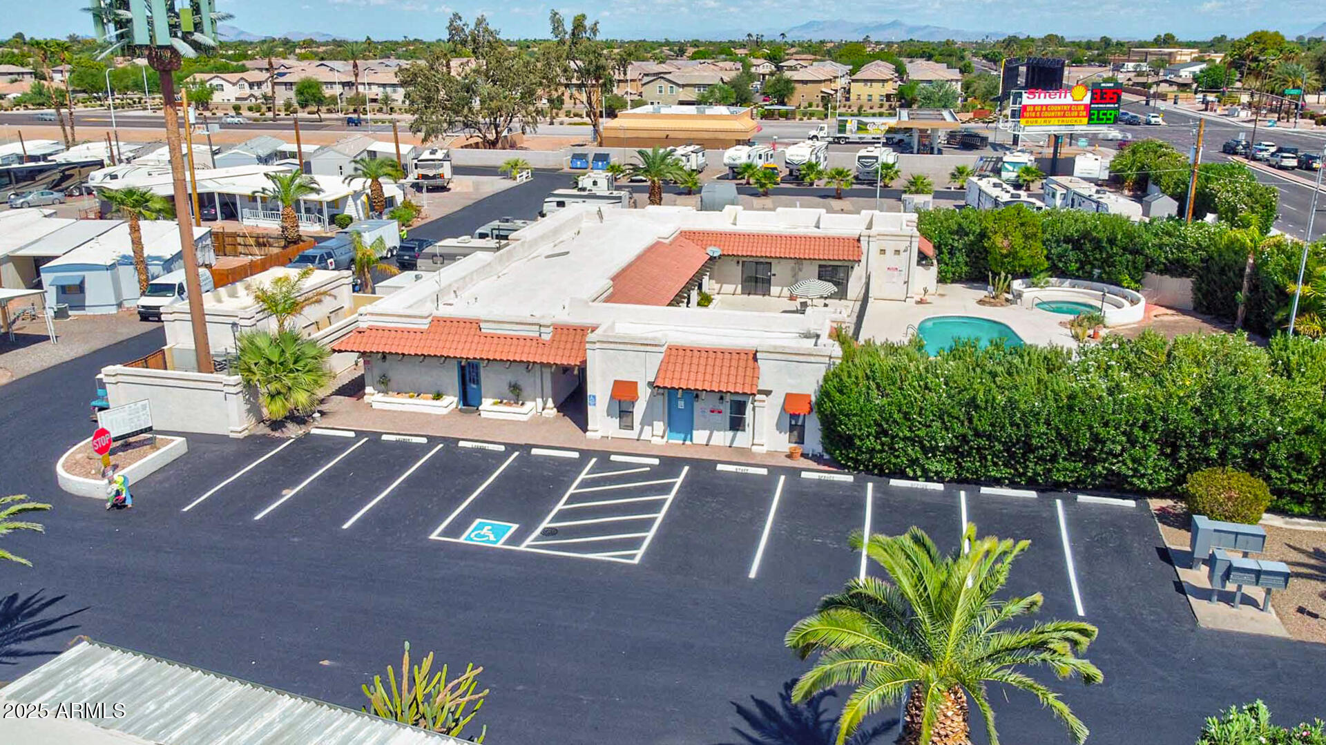 15606 South Gilbert Road, Unit 109 Chandler, AZ 85225 - Photo 27 of 49 an aerial view of multiple houses with yard