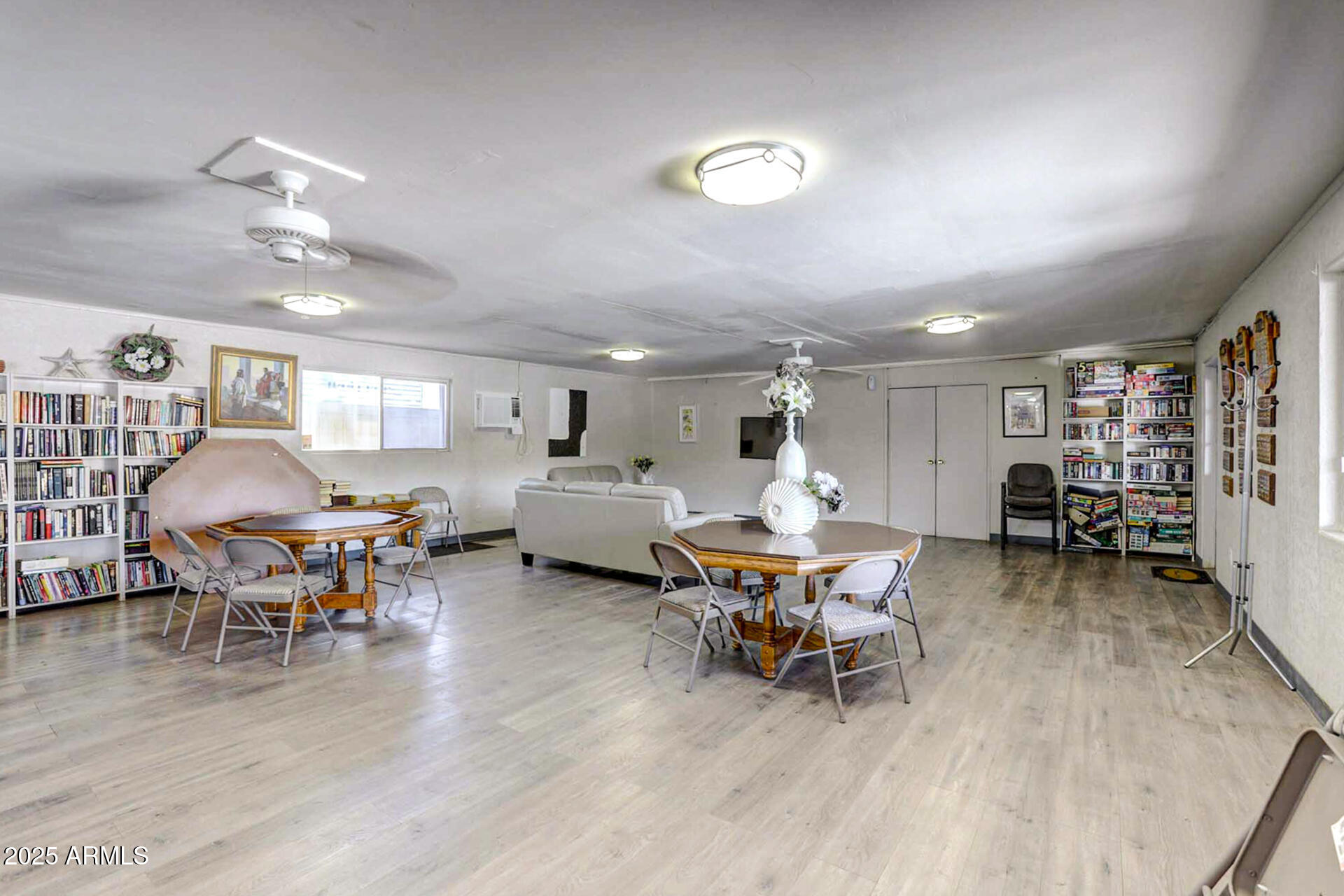15606 South Gilbert Road, Unit 109 Chandler, AZ 85225 - Photo 38 of 49 a living room with furniture and a wooden floor