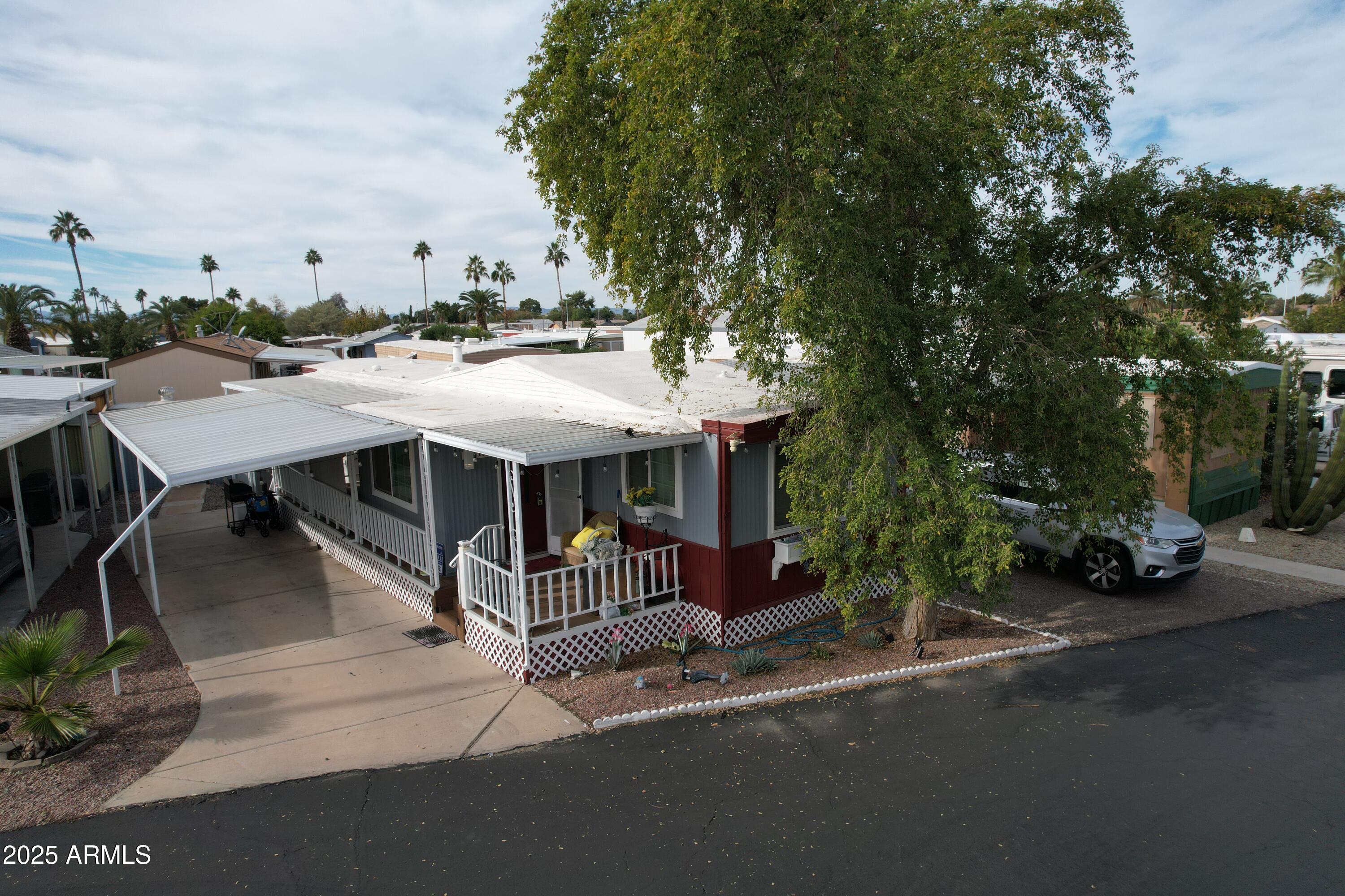 15606 South Gilbert Road, Unit 109 Chandler, AZ 85225 - Photo 45 of 49 a roof deck with table and chairs