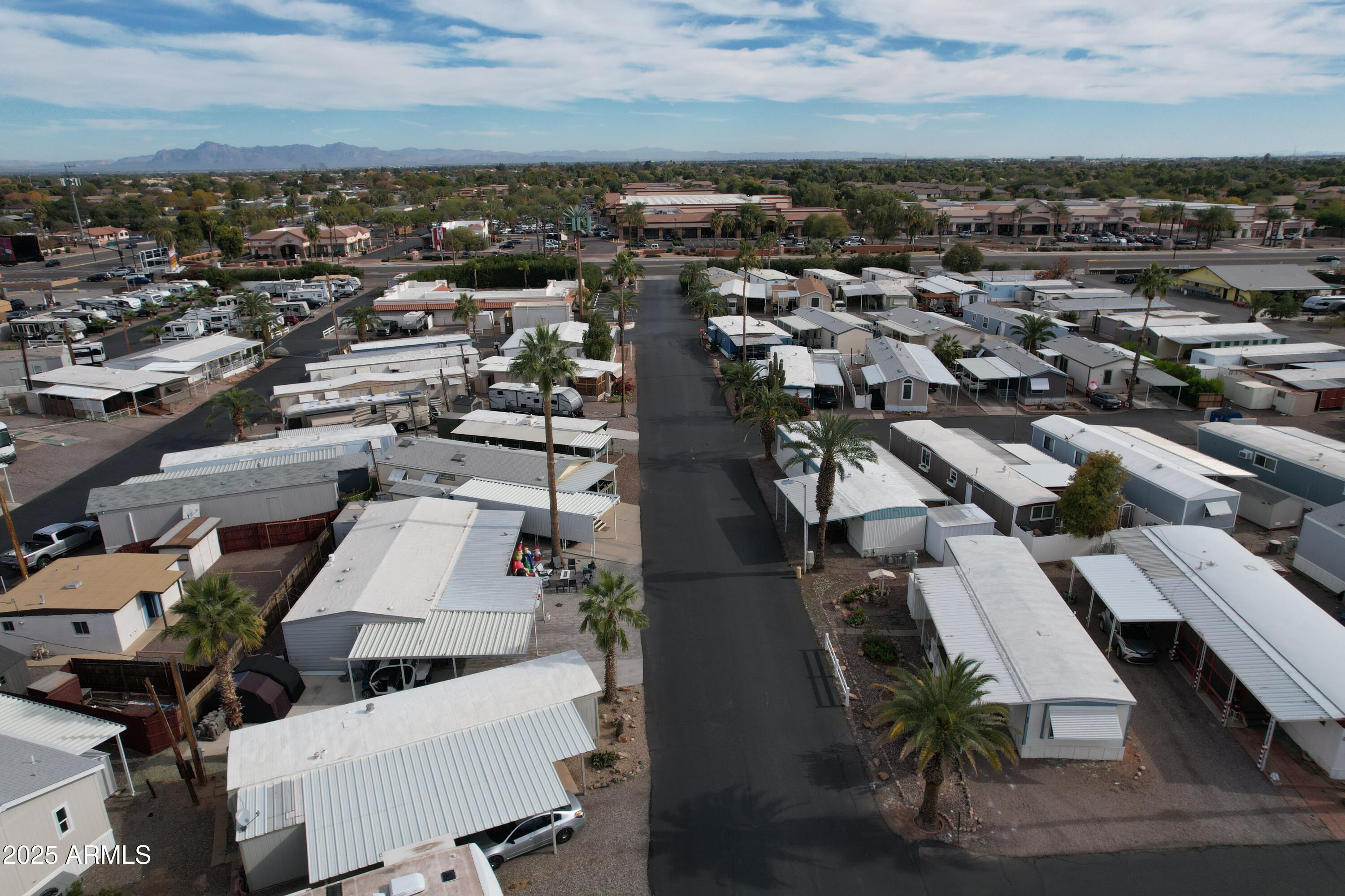15606 South Gilbert Road, Unit 109 Chandler, AZ 85225 - Photo 48 of 49 an aerial view of a residential building with lawn chairs