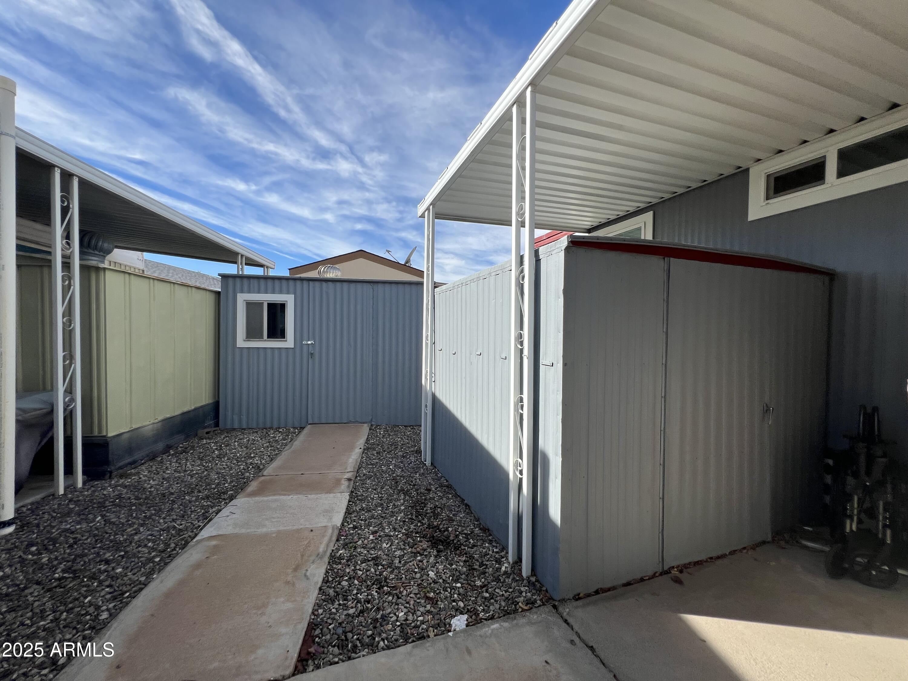 15606 South Gilbert Road, Unit 109 Chandler, AZ 85225 - Photo 49 of 49 a view of a house with a backyard