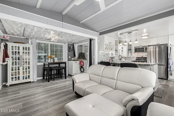 a living room with furniture and a table