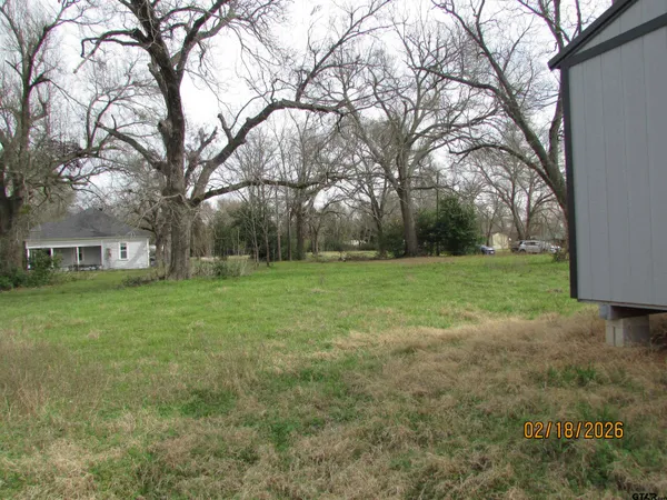 a view of a tree in front of a house
