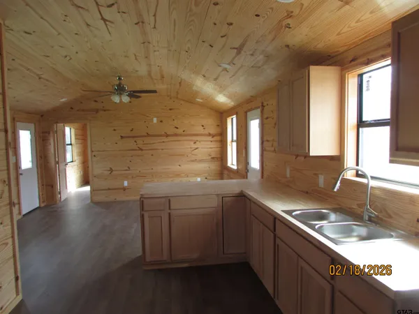 a kitchen with a sink and cabinets