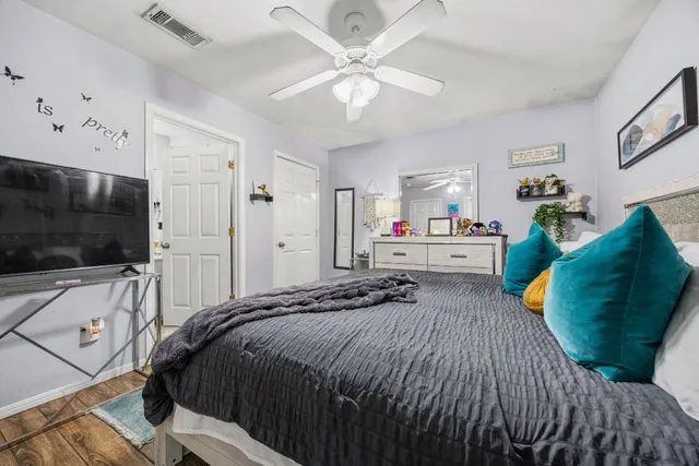 a bathroom with a sink vanity mirror and toilet