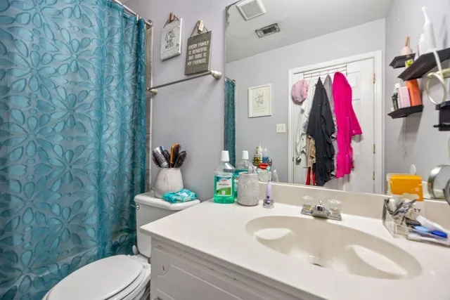 a utility room with sink dryer and washer
