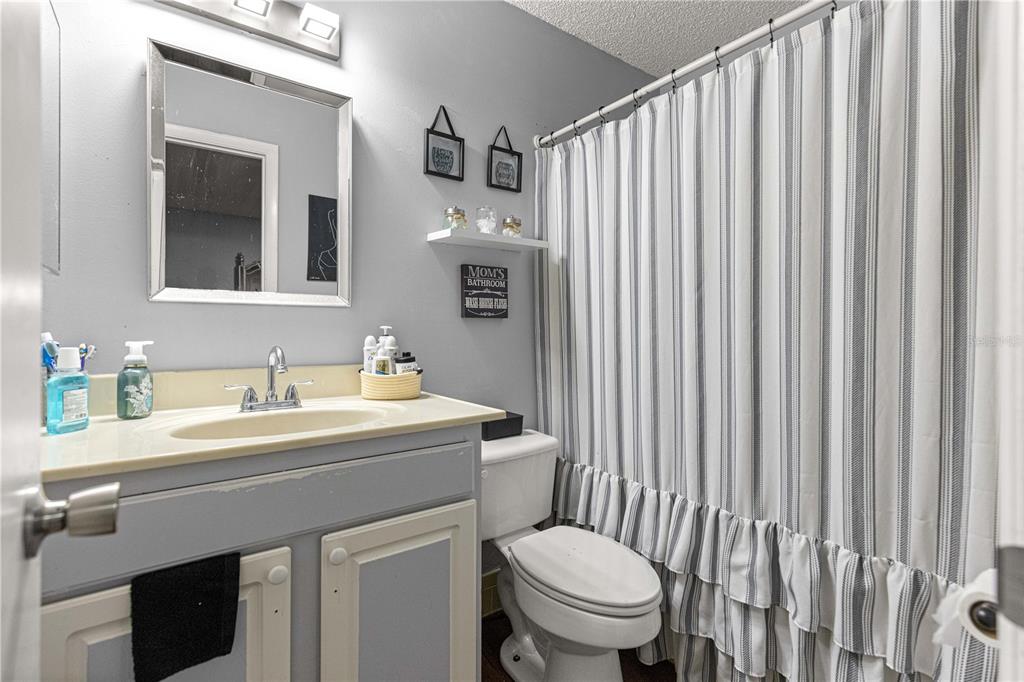 508 Emerald Road Ocala, FL 34472 - Photo 13 of 32 a bathroom with a sink a toilet and a mirror
