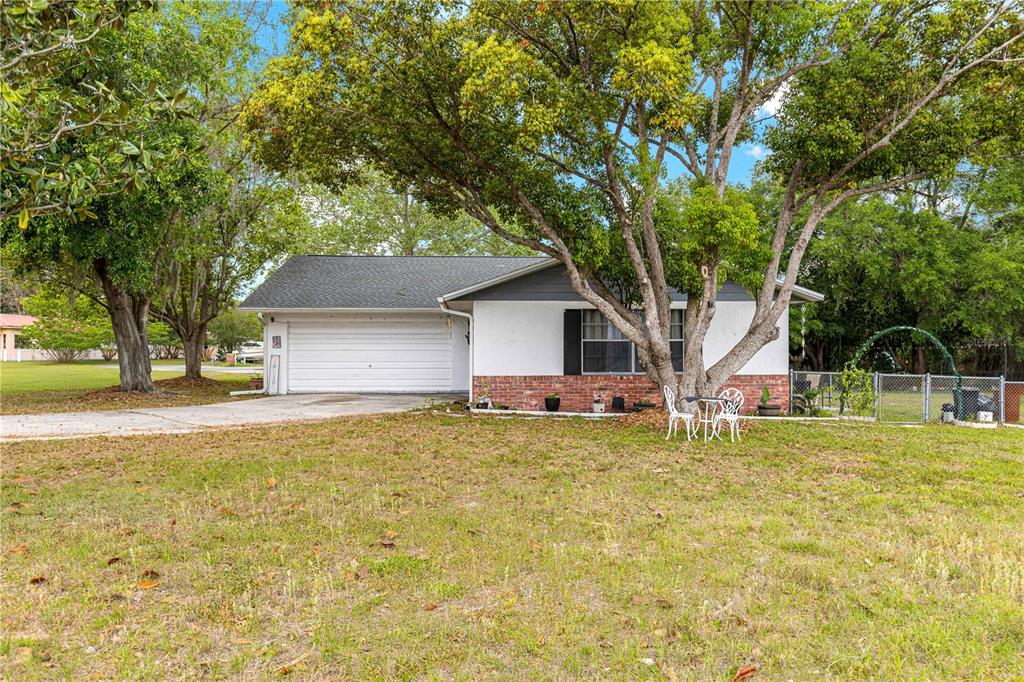 508 Emerald Road Ocala, FL 34472 - Photo 2 of 32 a house with swimming pool in front of it
