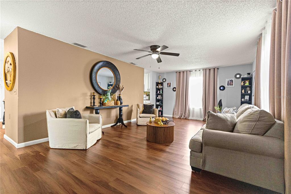 508 Emerald Road Ocala, FL 34472 - Photo 22 of 32 a living room with furniture and a large window