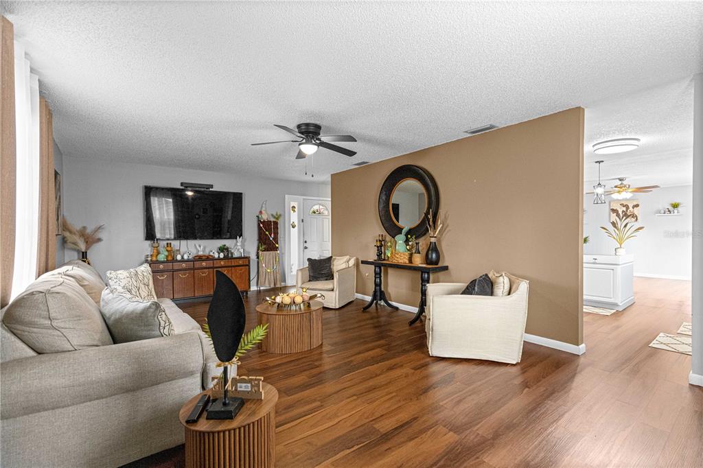 508 Emerald Road Ocala, FL 34472 - Photo 24 of 32 a living room with furniture and a flat screen tv