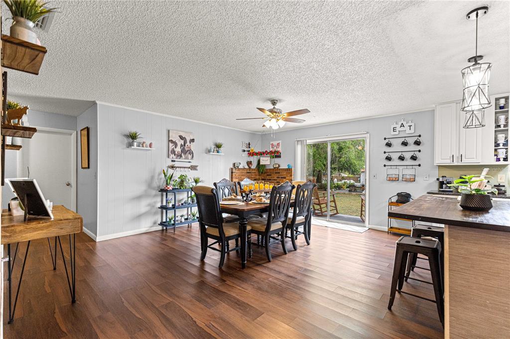508 Emerald Road Ocala, FL 34472 - Photo 10 of 32 a view of a dining room with furniture window and wooden floor