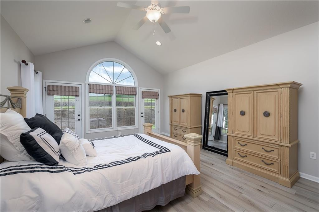 1147 Sarver Road Sarver, PA 16055 - Photo 12 of 19 a spacious bedroom with a bed and wooden floor