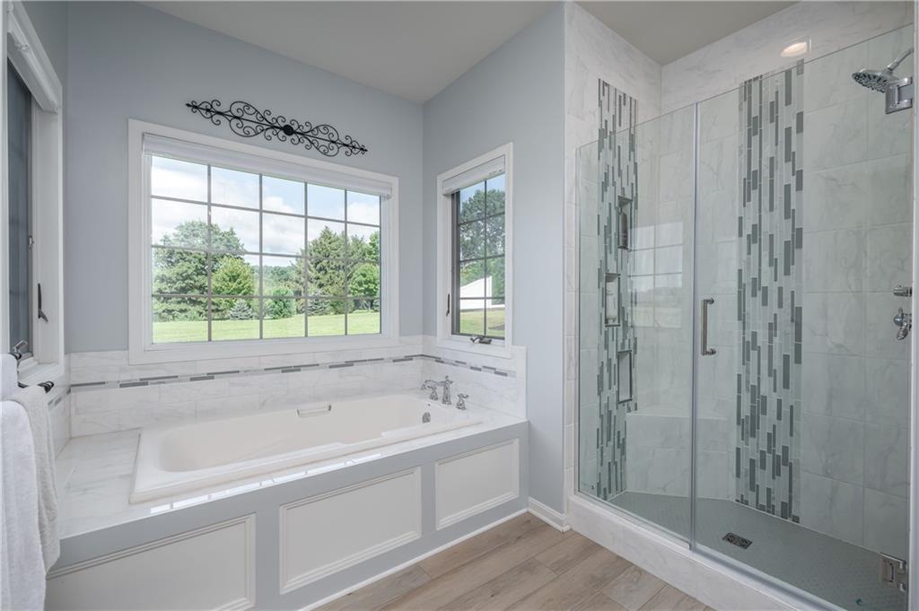 1147 Sarver Road Sarver, PA 16055 - Photo 14 of 19 a white bath tub sitting next to a shower