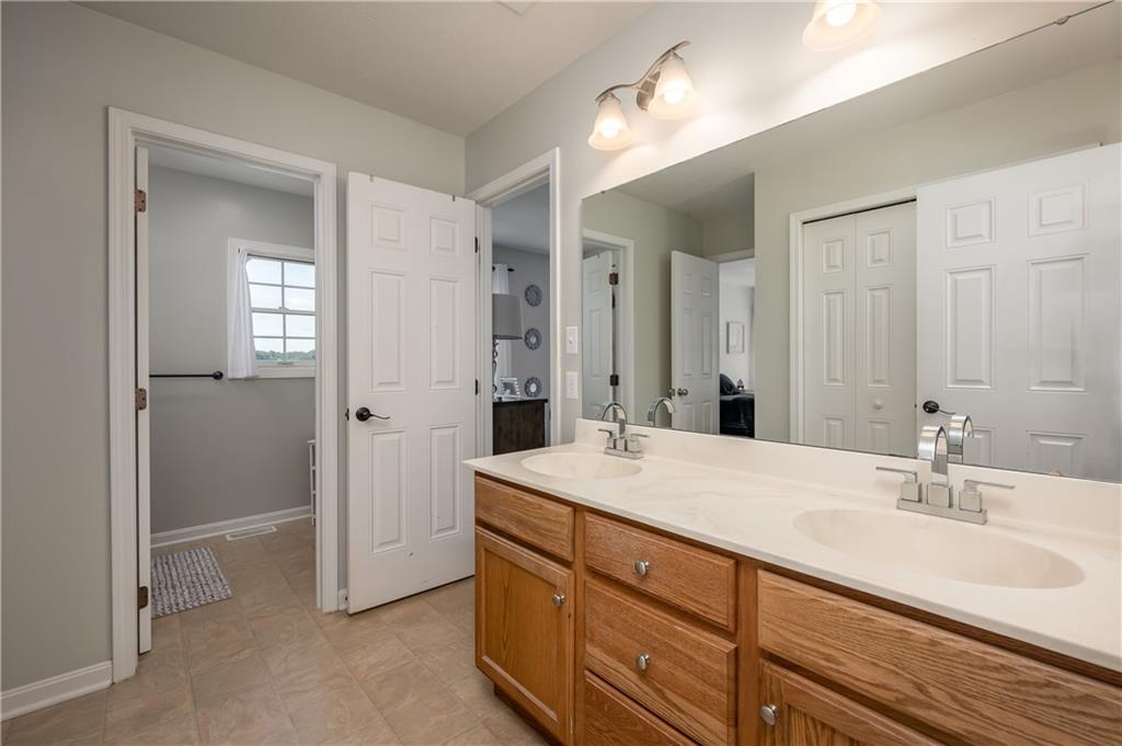 1147 Sarver Road Sarver, PA 16055 - Photo 18 of 19 a bathroom with a sink a vanity and a mirror
