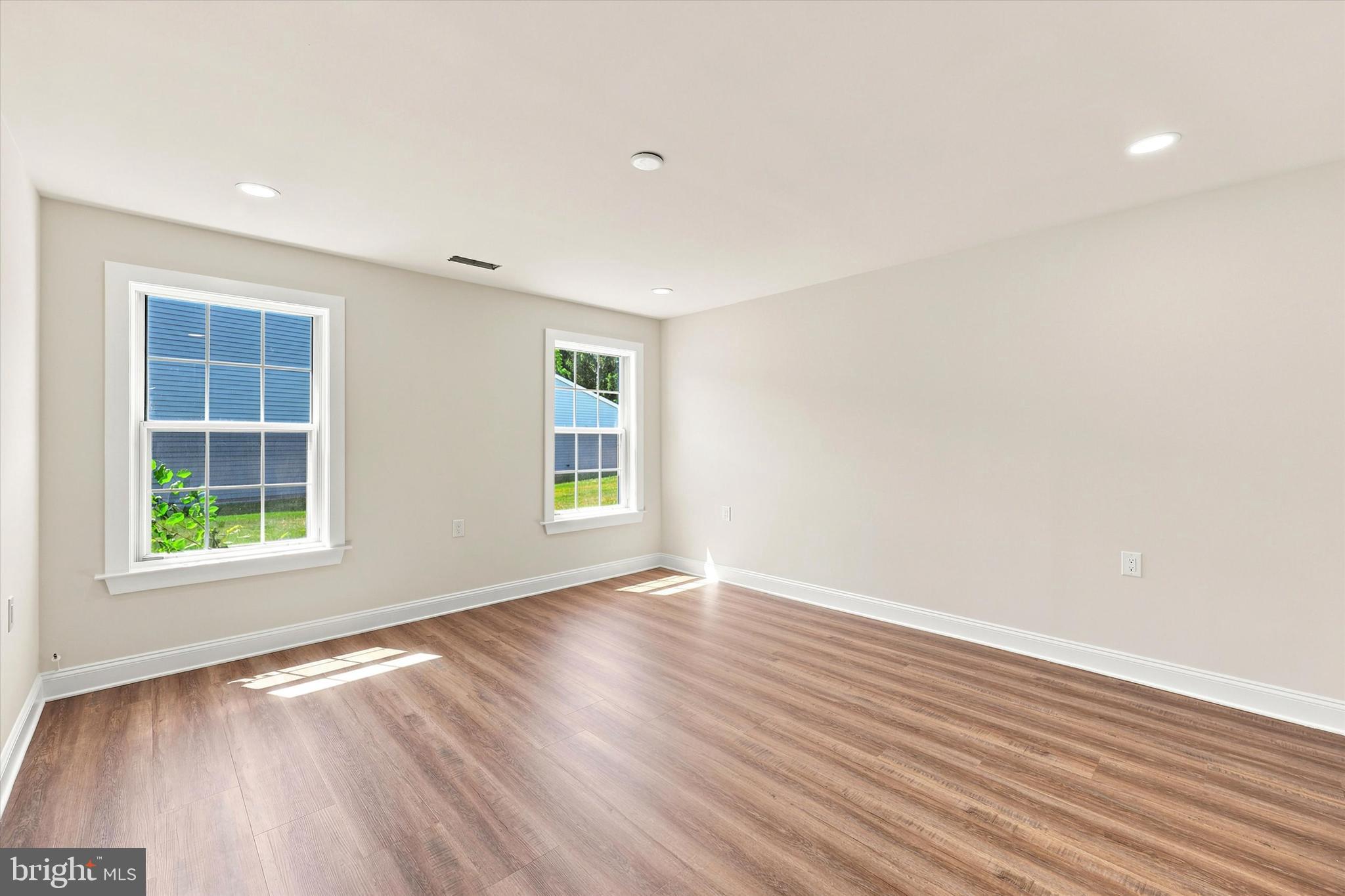 2 Emory Lane Mount Laurel, NJ 08054 - Photo 12 of 25 an empty room with wooden floor and windows