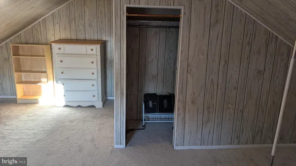 a view of an empty room and closet