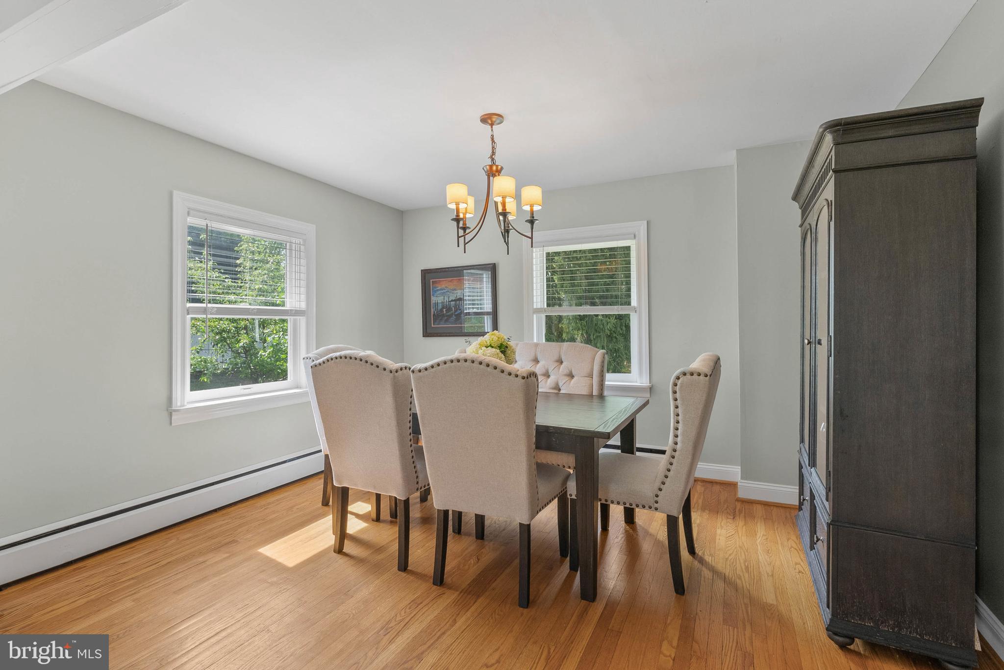 2546 Mansion Road Huntingdon Valley, PA 19006 - Photo 7 of 43 a dining room with furniture a chandelier and wooden floor