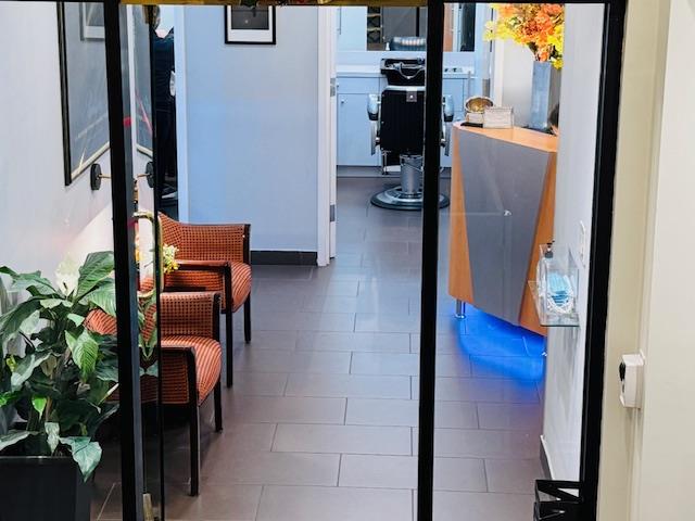 111 East 56th Street, Unit 712 Manhattan, NY 10022 - Photo 11 of 16 view of living room with furniture and entryway