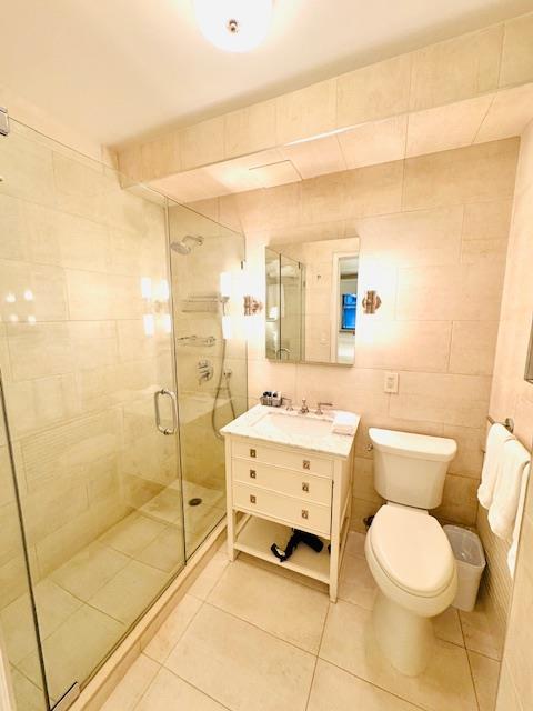 111 East 56th Street, Unit 712 Manhattan, NY 10022 - Photo 4 of 16 a bathroom with a toilet a sink and a shower