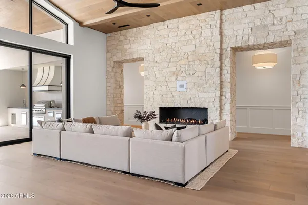 a kitchen with cabinets and chairs