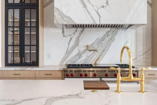 a kitchen with a sink and an oven