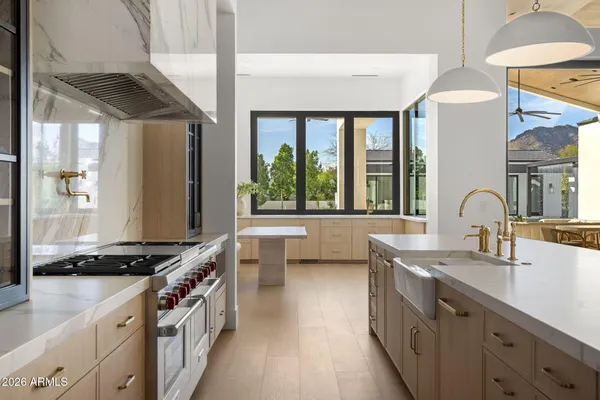 a bathroom with a sink a mirror and a shower