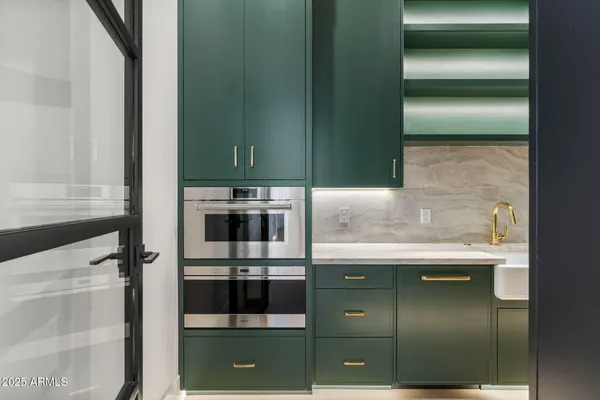 a spacious bedroom with a bed and a couch