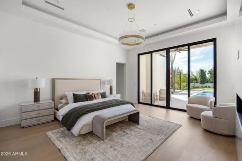 a spacious bedroom with a bed and a couch