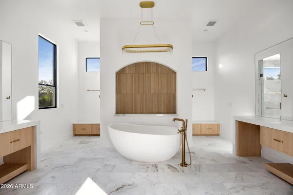 a living room with furniture and a projector screen