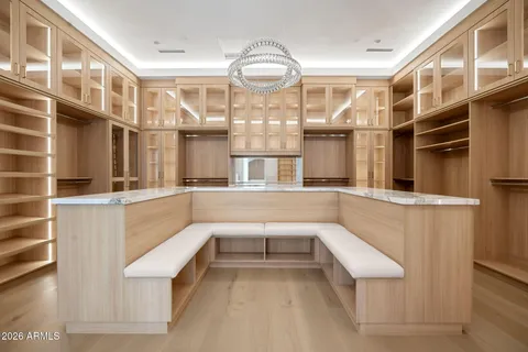 a kitchen with a table chairs stove and cabinets