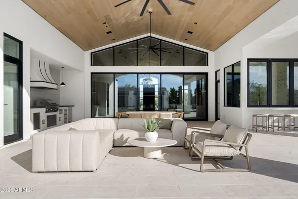 a living room with a couch and chairs