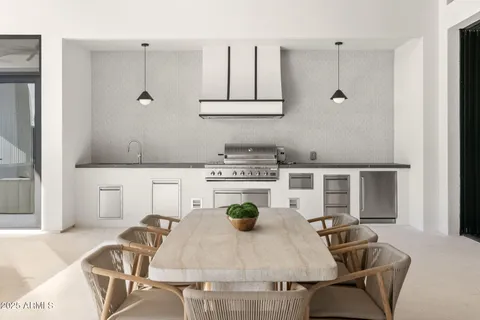 a kitchen with a table and chairs in it