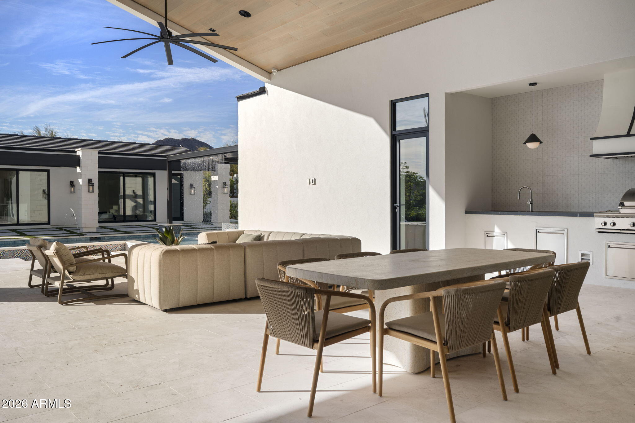 4534 East Pebble Ridge Road Paradise Valley, AZ 85253 - Photo 35 of 60 a kitchen with a table and chairs in it