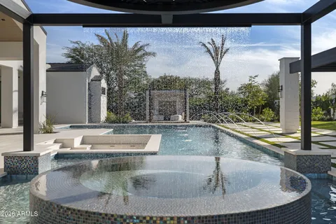 a swimming pool with outdoor seating and yard