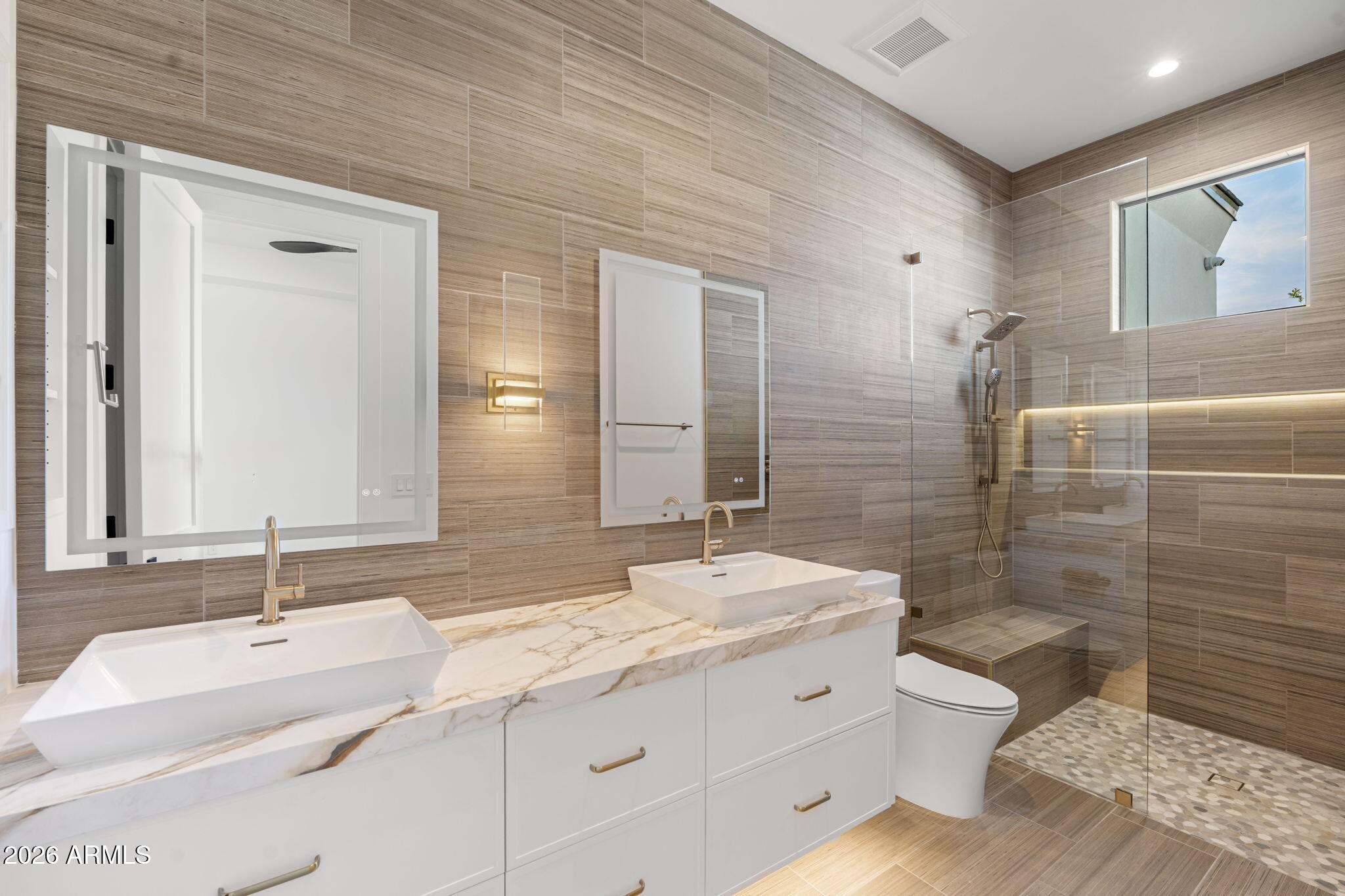 4534 East Pebble Ridge Road Paradise Valley, AZ 85253 - Photo 54 of 60 a bathroom with a double vanity sink toilet and shower