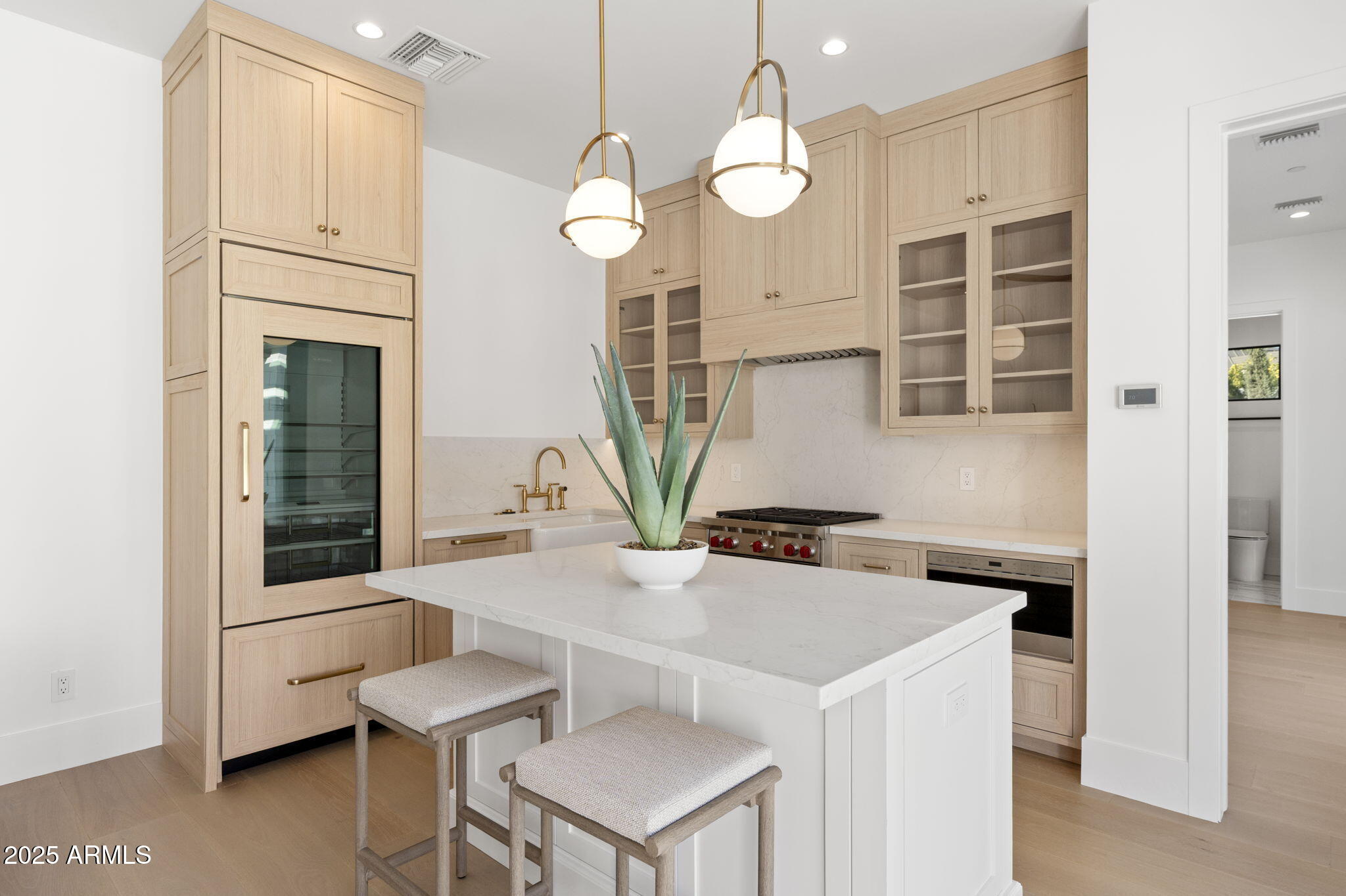 4534 East Pebble Ridge Road Paradise Valley, AZ 85253 - Photo 56 of 60 a kitchen that has a cabinets and a stove