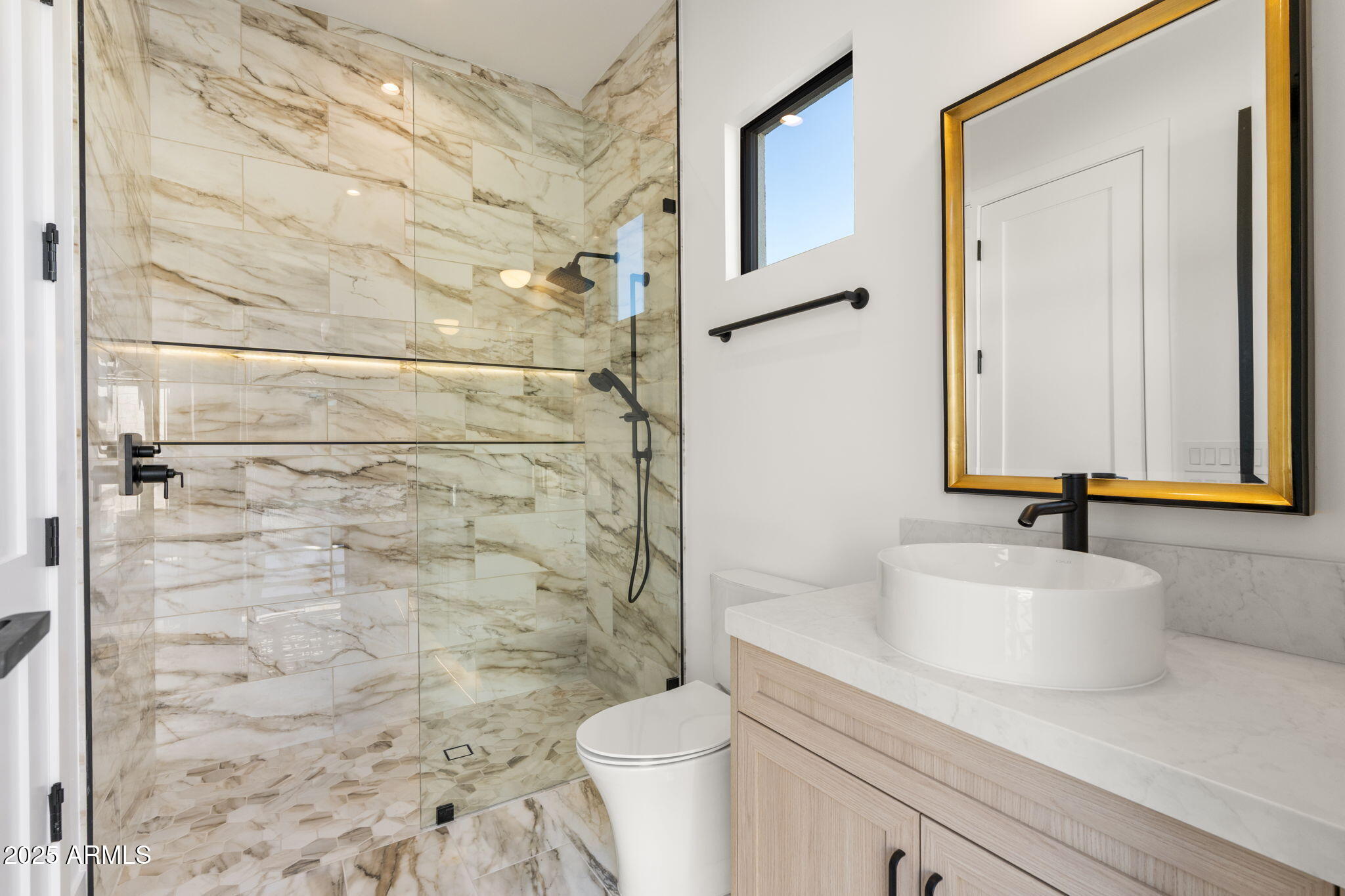 4534 East Pebble Ridge Road Paradise Valley, AZ 85253 - Photo 59 of 60 a bathroom with a sink a toilet and a mirror