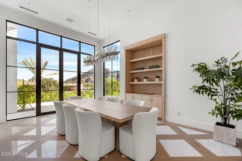 a dining room with furniture and window