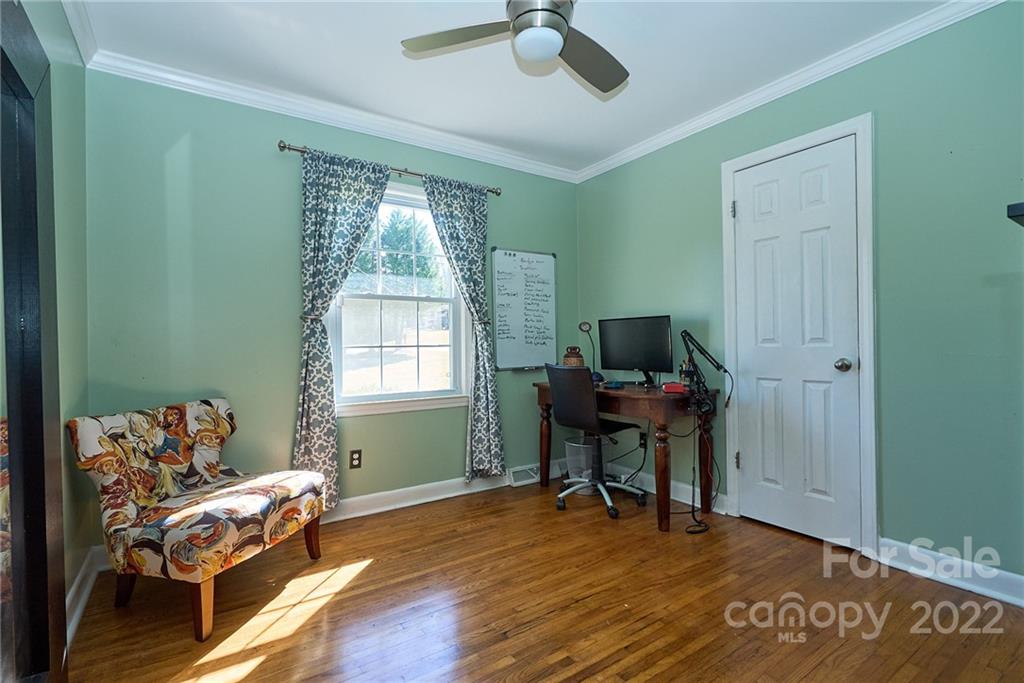 3112 Wolf Pond Road Monroe, NC 28112 - Photo 20 of 29 a living room with furniture and a window