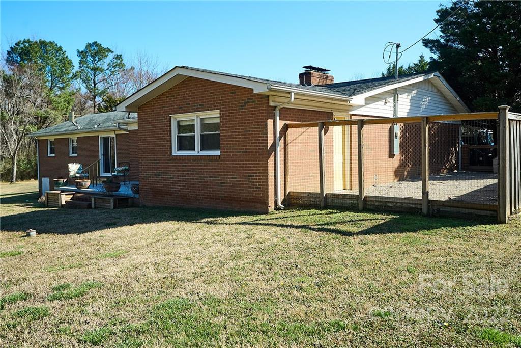 3112 Wolf Pond Road Monroe, NC 28112 - Photo 23 of 29 a front view of a house with garden