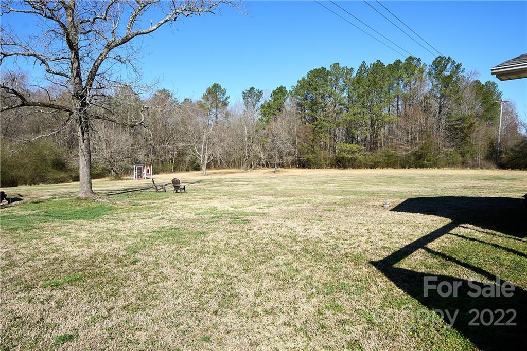 3112 Wolf Pond Road Monroe, NC 28112 - Photo 24 of 29 a view of an outdoor space with yard