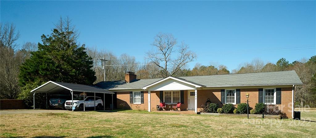 3112 Wolf Pond Road Monroe, NC 28112 - Photo 29 of 29 a front view of a house with garden