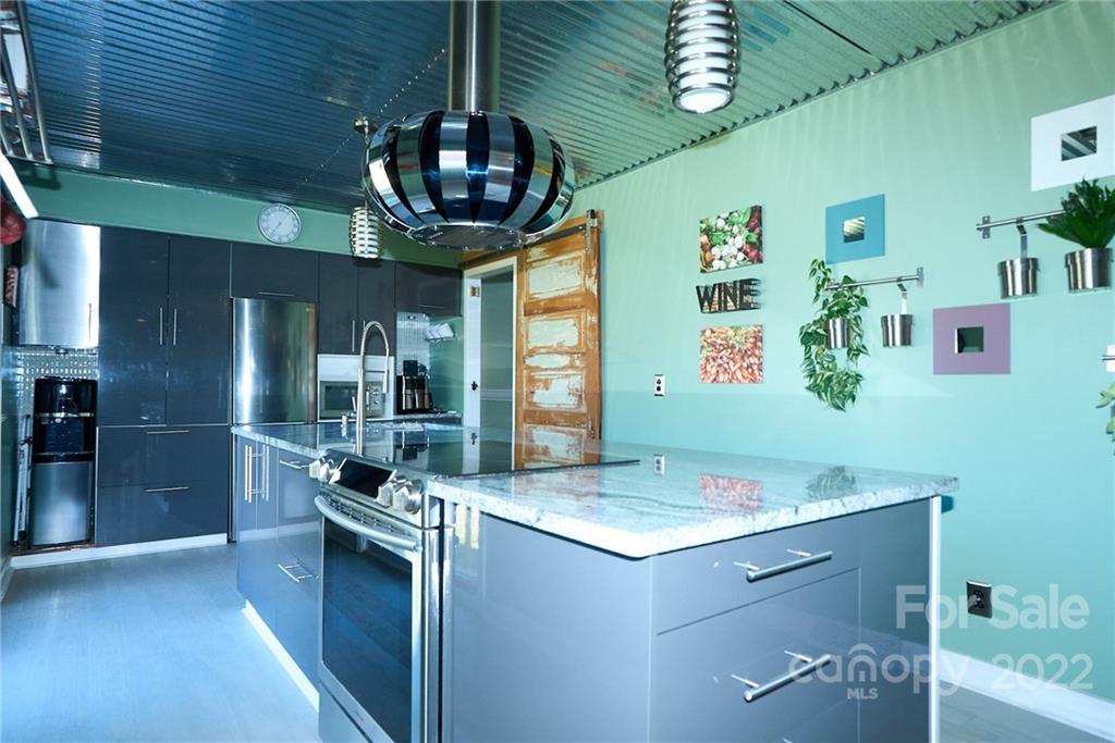 3112 Wolf Pond Road Monroe, NC 28112 - Photo 5 of 29 a kitchen with a counter space cabinets and appliances