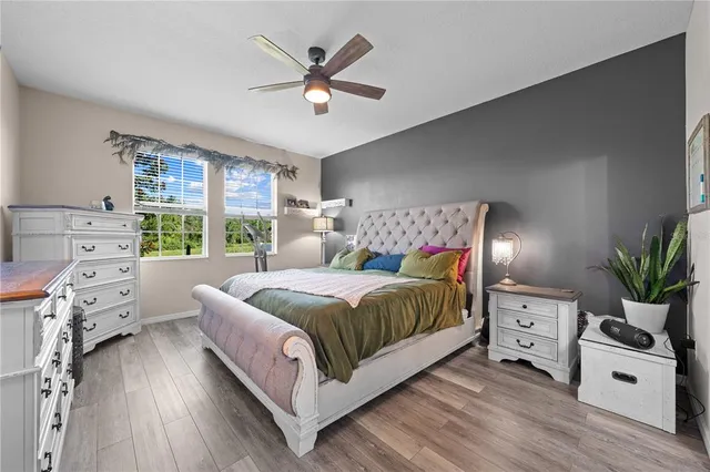 a bedroom with a bed and a tv