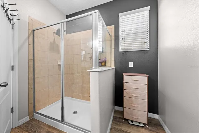 a white toilet sitting next to a bathroom sink