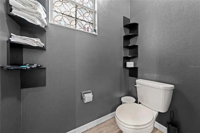 a view of a storage and utility room with washer and dryer